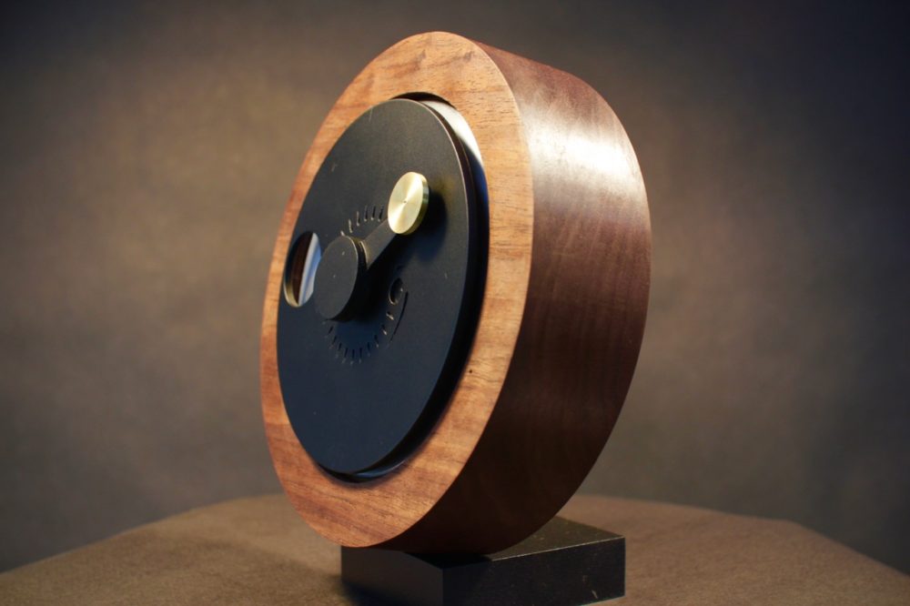 A wooden clock for displaying the position of the moon and sun. 