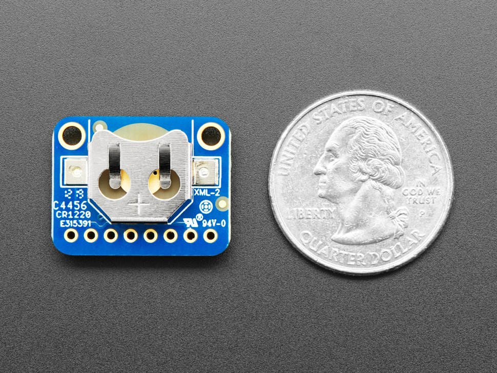 A real-time clock (RTC). The actual chip is on the other side, here we see the (often included) coin-cell holder that will power the RTC for several years. This particular model also does not have an external crystal. Others do, which looks like a small metal tube. 